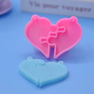 Detail of heart puzzle silicone molds with hanging holes for DIY resin craft making