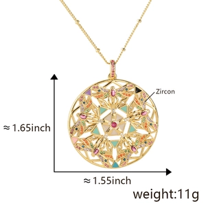 Detail view of gold dragonfly pendant with zircon inlay showing size 1.65 inch and 11g