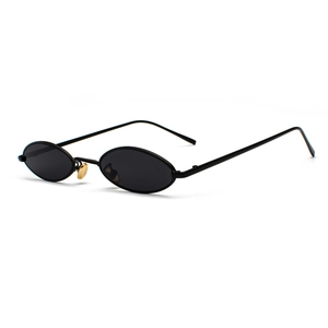 Retro oval black metal sunglasses with minimalist frame shown from a side view angle