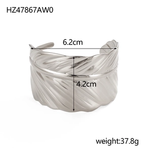 Silver feather cuff bracelet with 6.2cm width and 37.8g weight on white background