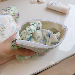 Floral print cotton mini pouch bag with zipper and green tassel for small accessories