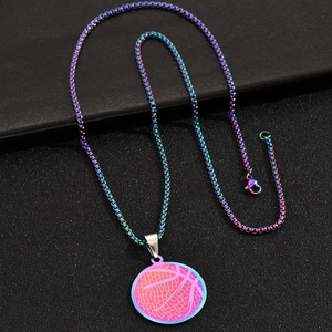 Detailed macro view of a colorful rainbow basketball pendant with a textured surface