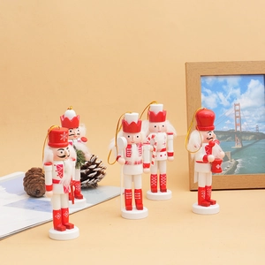 Set of four red and white wooden Christmas nutcrackers with glitter and hanging strings