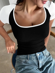 Close-up of Y2K style slim fit U-neck tee with contrast raglan sleeves in black and white