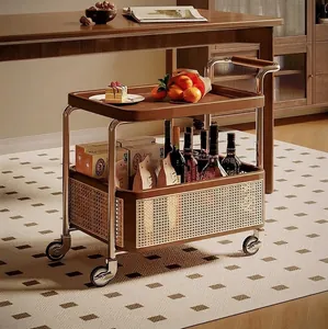 Detail view of double-layer stainless steel trolley with walnut trays and woven panels