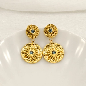 Vintage gold starburst drop earrings with hammered texture and blue center stones
