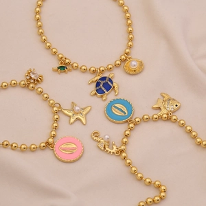 18K vergoldetes Ozean-Armband mit Emaille-Schildkröte Seestern und Perlenanhängern