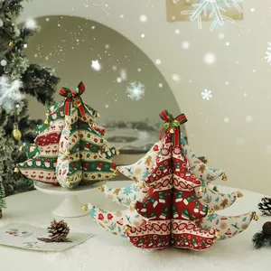 Handcrafted Christmas tree fabric ornaments with bells for festive tabletop decoration