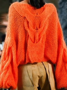 Bright orange cable knit sweater with back cutout and round neck for women