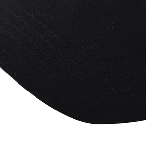 Close-up of black cotton ponytail baseball hat brim with parallel reinforced stitching