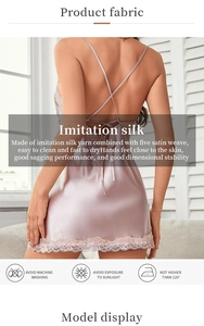 Detail of cross-back straps and delicate lace hem on champagne pink silk slip dress