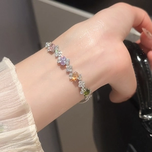 Macro detail of elegant oval multicolor zircon bracelet with sparkling gemstone inlay