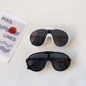 Retro oversized kids sunglasses in black and white frames for UV protection
