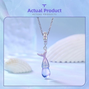 Close-up of S925 sterling silver mermaid tail pendant with gradient purple accents