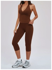 Detail of dark brown yoga set featuring a halter slim vest and high-waisted leggings
