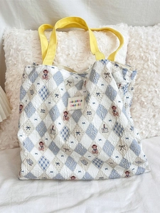 Quilted blue and white bubble fabric bear tote bag with bright yellow canvas handles
