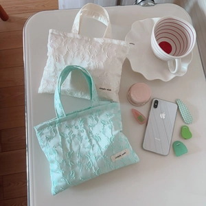Floral jacquard fabric mini tote bag in mint green and white with zipper closure