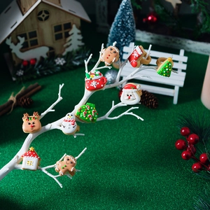 Christmas mini cookie cutter set on a white branch display with festive ornaments