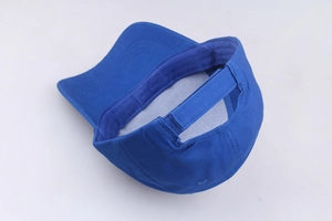 Macro view of blue baseball cap interior top and adjustable hook and loop closure