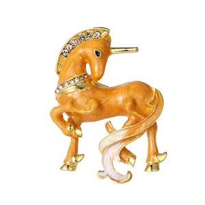 Orange enamel unicorn brooch pin with white rhinestones and gold-plated metal base