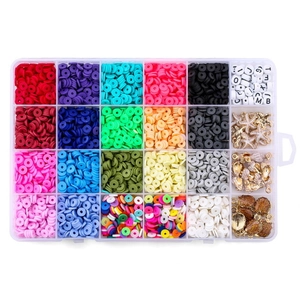 Flat lay of 24-grid jewelry set with clay beads, letter beads and sea charms