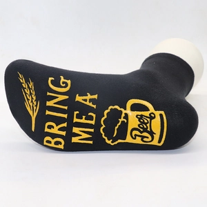 Detail of anti-slip letter print and beer cup pattern on black cotton crew socks