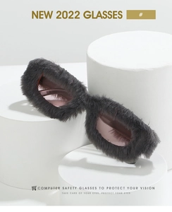 Detail of creative square sunglasses with dark gray plush frame and tinted lenses