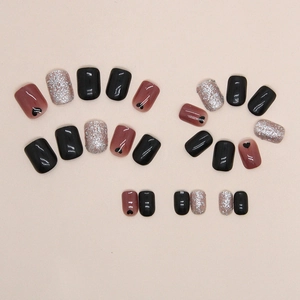 Short black heart press-on nails set with glitter and mauve purple colors