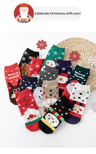 Detail of colorful cotton Christmas socks featuring festive Santa and reindeer patterns