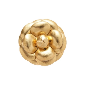Elegant gold leather camellia flower brooch with layered petals and metallic texture