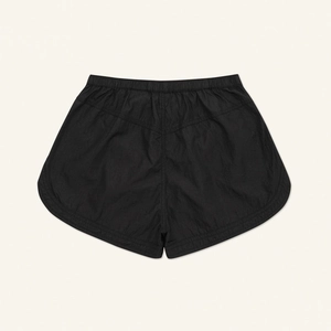 Detailed view of black athletic jogging shorts with elastic drawstring waistband