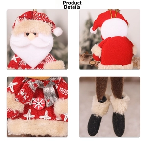 Detail view of plush Santa ornament showing knit textures and snowflake button patterns