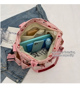 Top view of large capacity pink canvas tote bag with cherry print showing internal storage