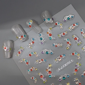 Detailed view of 5D jelly nail stickers with colorful rhinestones on silver base