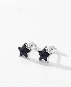 Detail of S925 sterling silver star stud earrings with shimmering blue sandstone