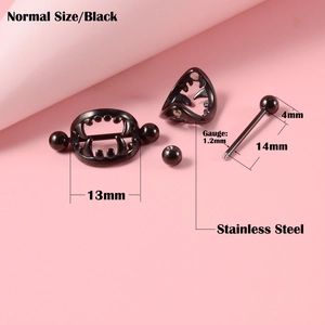 Detailed view of black stainless steel fang nipple ring with 14mm bar and size markings