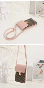 Detailed close-up of small crossbody phone bag with pink flap and geometric brown pattern