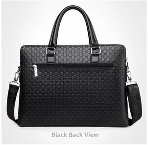 Detail view of the black leather briefcase back featuring embossed patterns and zipper pocket