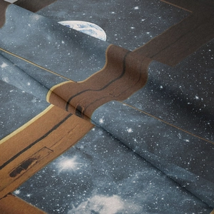 Close-up of bohemian tapestry fabric showing galaxy print and soft woven texture