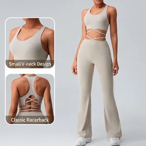 Two-piece beige yoga set with V-neck cross-strap sports bra and flared leggings