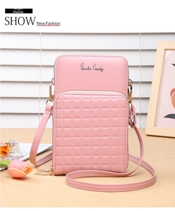 Detailed close-up of pink PU leather phone bag with lattice texture and gold zipper