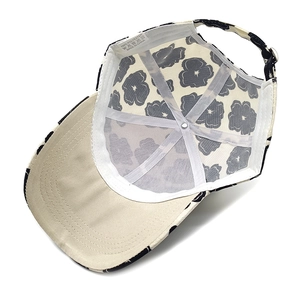 Detail of baseball cap interior showing breathable white mesh lining and quality stitching