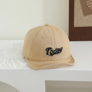 Detail of baby soft brim baseball cap featuring black Today embroidery in khaki cotton