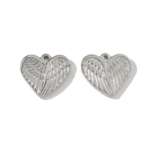 Detailed view of silver stainless steel heart wing charms for DIY jewelry making