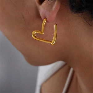 Minimalist 18k gold plated stainless steel heart hoop earrings for women on model