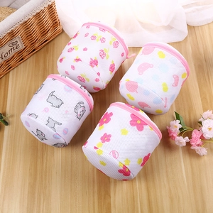 Detail view of mesh laundry bags with floral and cat prints for bra and lingerie protection