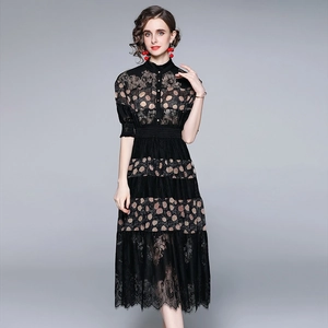Elegant black lace midi dress with polka dot patterns and a sophisticated stand collar