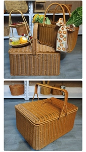 Detail of hand-woven wicker picnic basket with sturdy handles and reinforced lid design