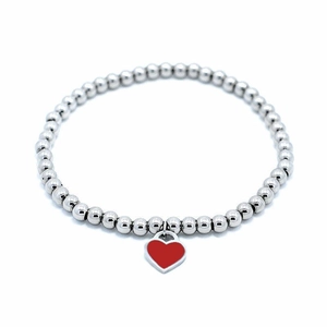 Detail of 4mm stainless steel beaded bracelet with a red enamel heart charm and metal trim