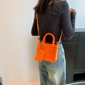 Orange croc-pattern handbag with small coin purse, stylish tote for commute or crossbody use